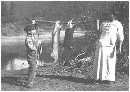 Fisherman on Embankment on a Tributary of Volga River with a Primitive  Fishing Rod Made of Tree Branch Editorial Stock Photo - Image of fishing,  landscape: 198115053